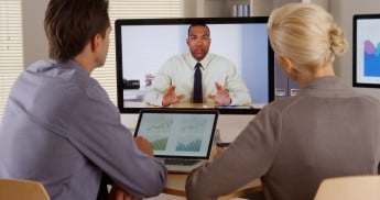 Businessteam listening to manager in a video conference