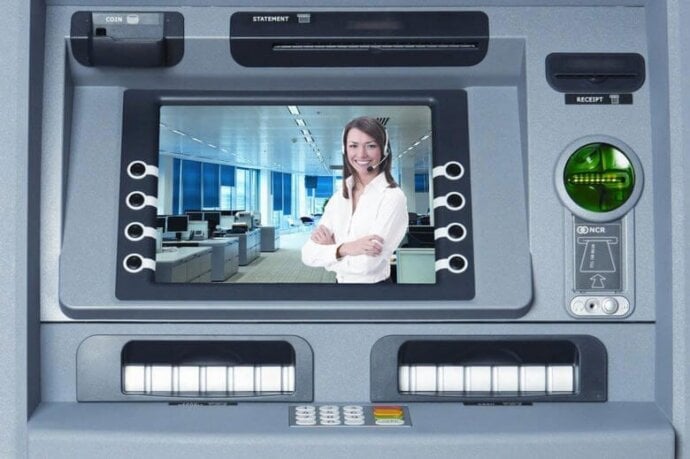 Customer service representative on an ATM screen, suggesting live assistance or video banking support.